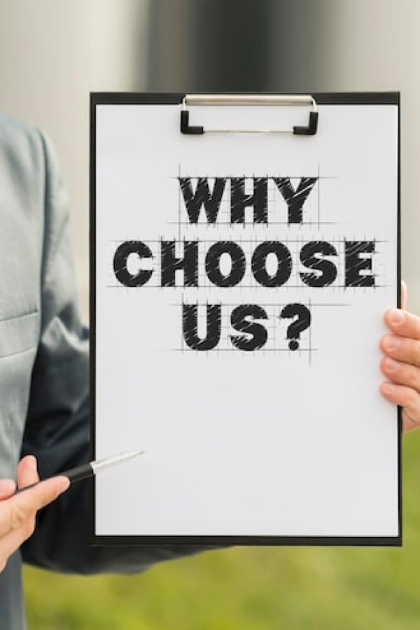 business man holding clipboard with why choose us question 23 2148932318